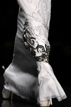 Dior by John Galliano FW2009 — silver filigree scrollwork overlay panels and sequin hem detail runway