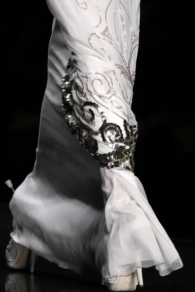 Dior by John Galliano FW2009 — silver filigree scrollwork overlay panels and sequin hem detail runway
