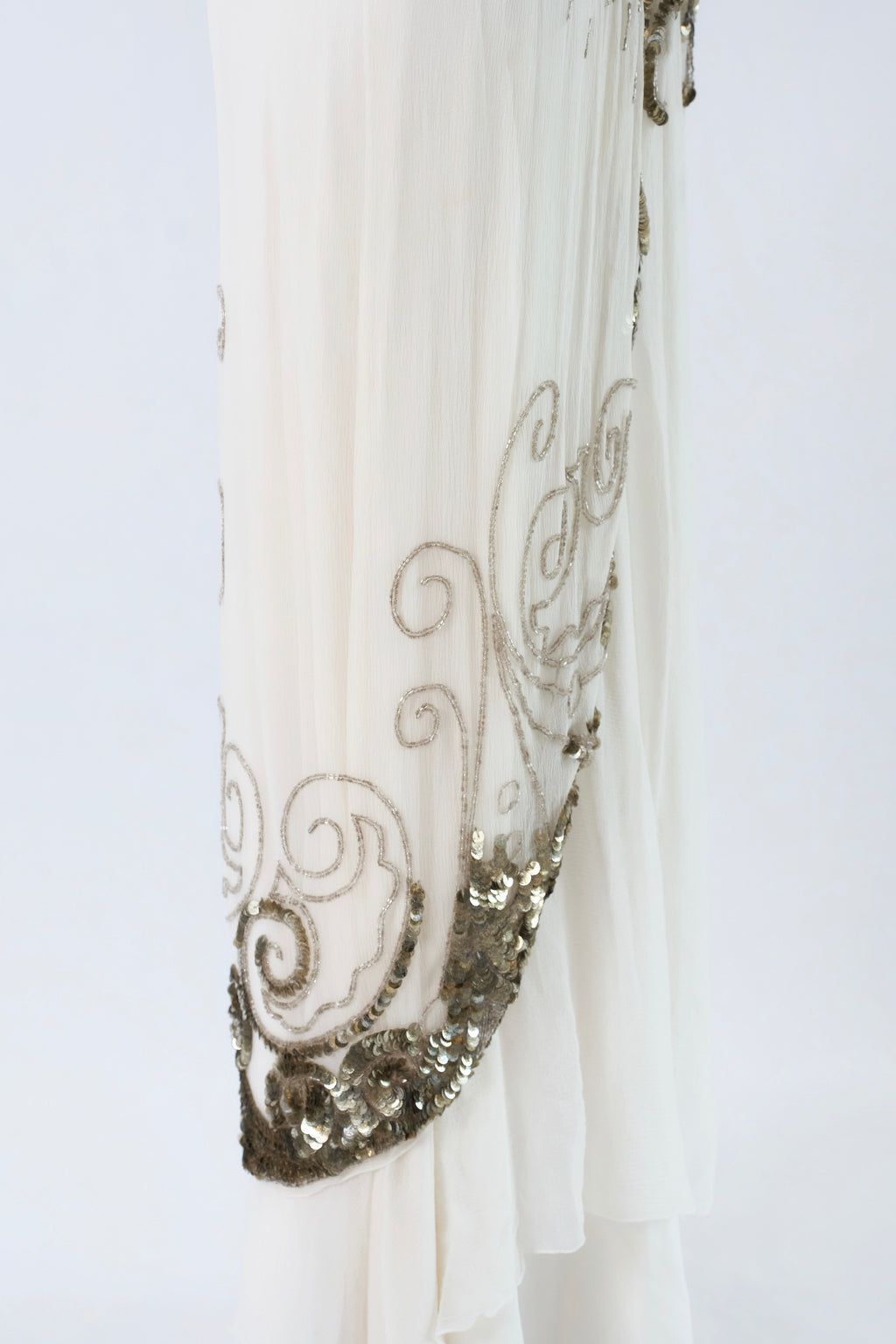 Dior by John Galliano FW2009 — side view silver sequin scrollwork hem panel detail