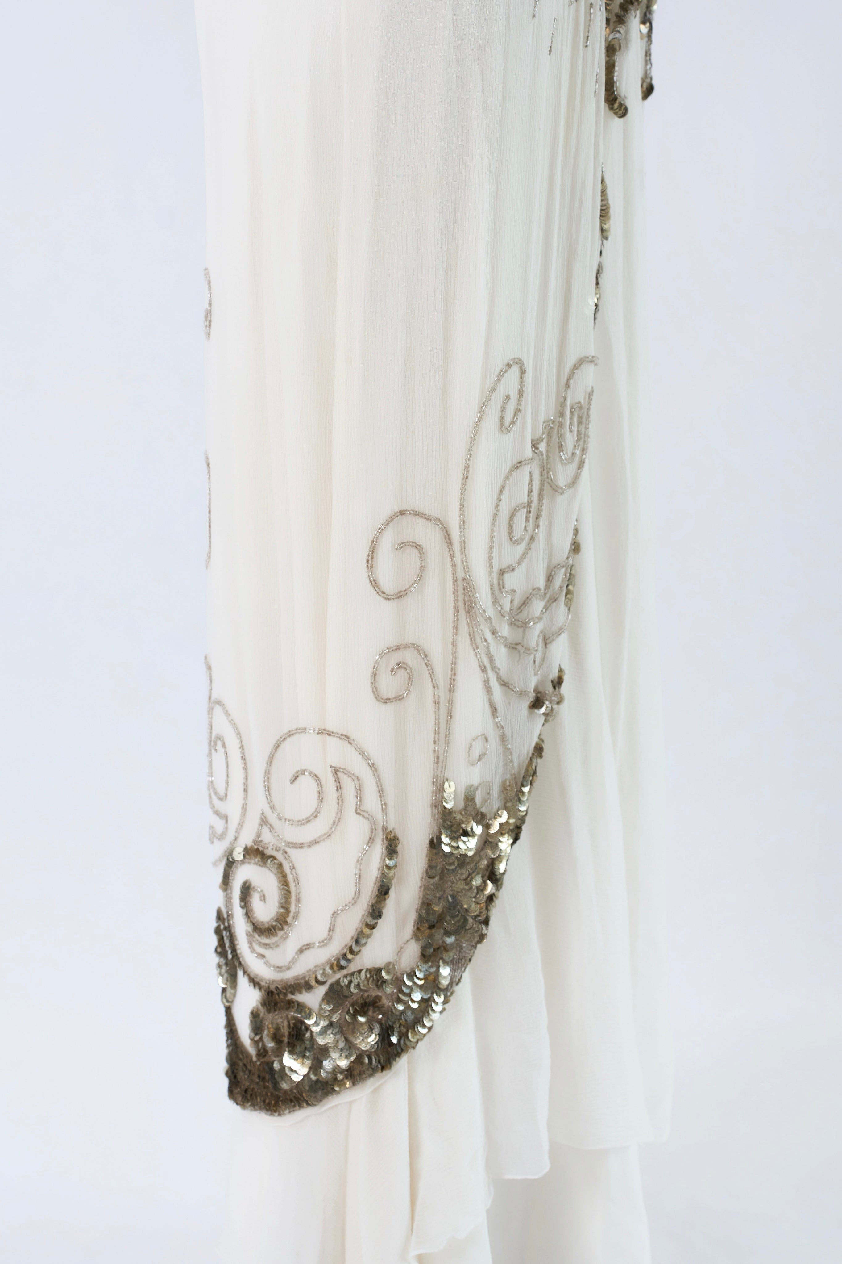 Dior by John Galliano FW2009 — side view silver sequin scrollwork hem panel detail