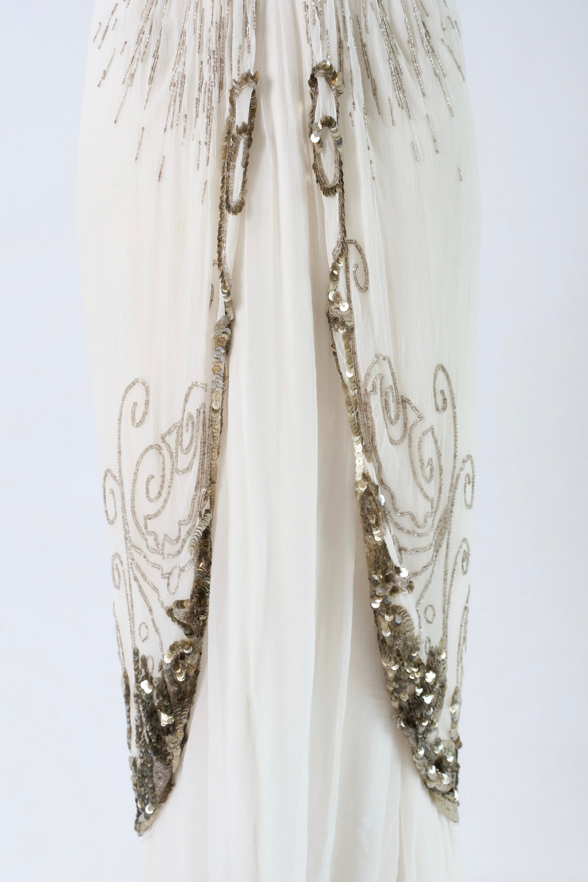 Dior by John Galliano FW2009 — silver filigree scrollwork overlay panels and sequin hem detail