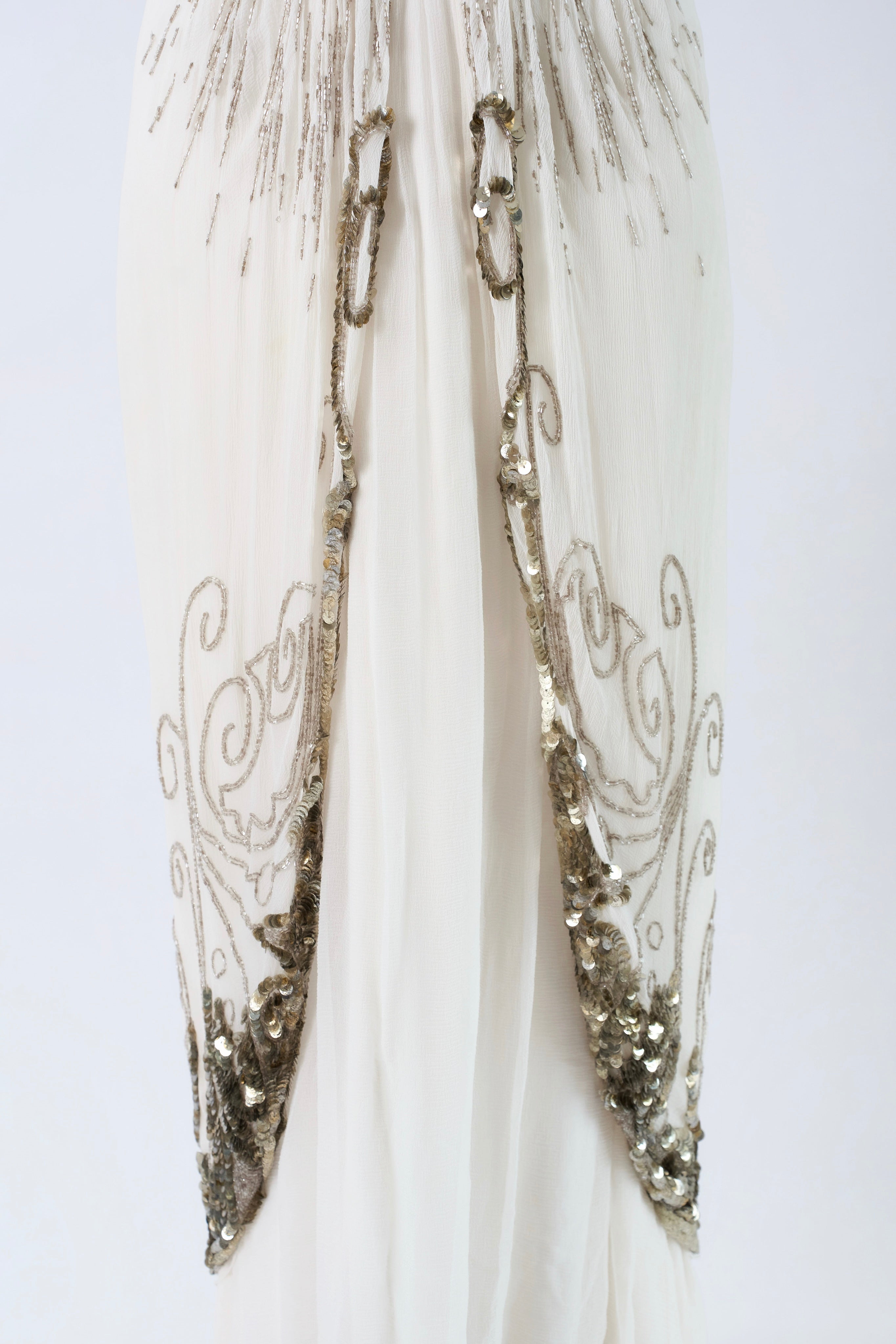 Dior by John Galliano FW2009 — silver filigree scrollwork overlay panels and sequin hem detail