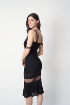John Galliano SS1998 black pointelle knit dress — side view showing elongated silhouette and mesh transition