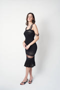 John Galliano SS1998 black pointelle knit dress — side view showing elongated silhouette and mesh transition