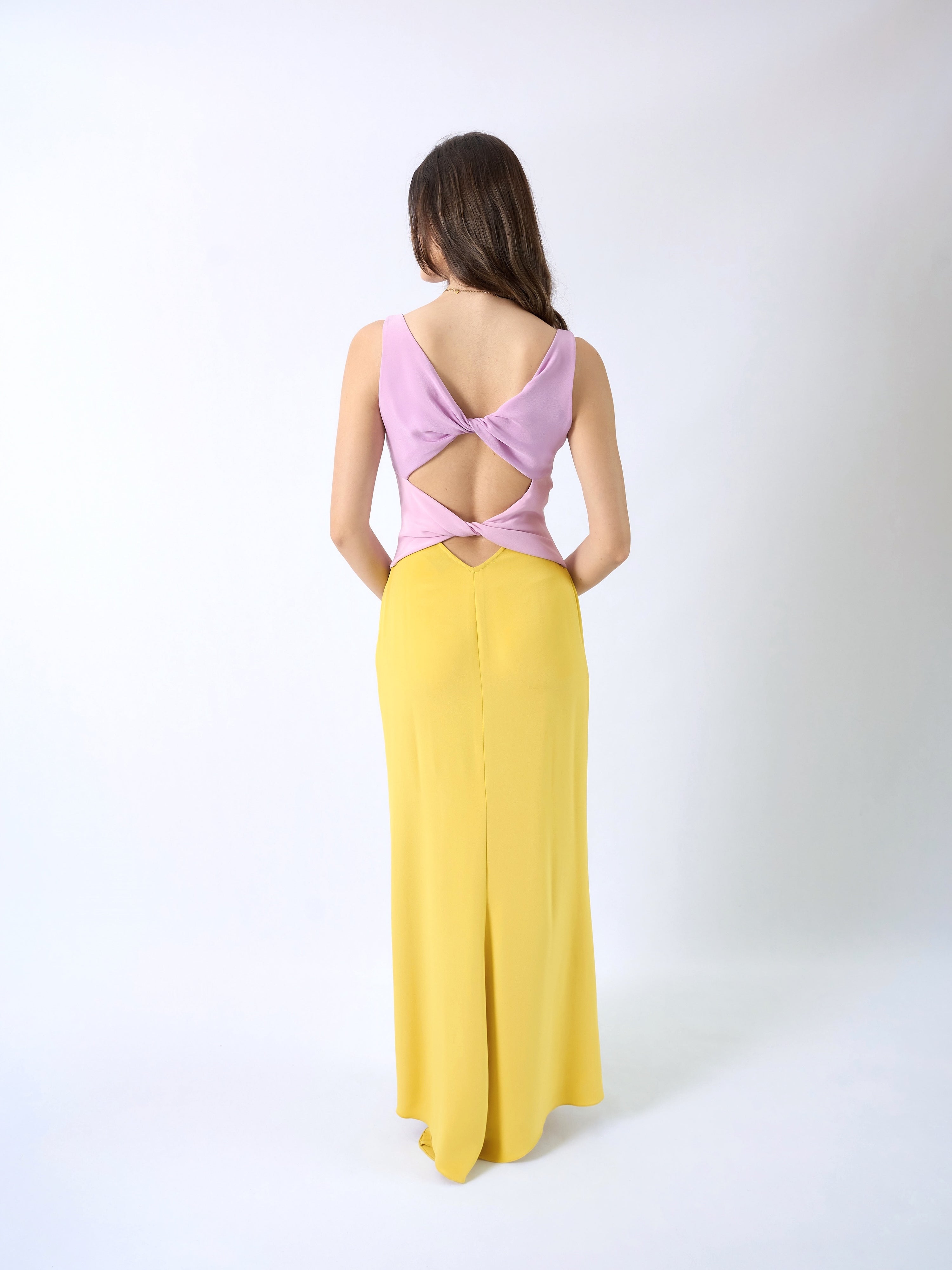 Valentino SS1998 — full back view showing deep open back with twisted fabric bands and V-waist cutout